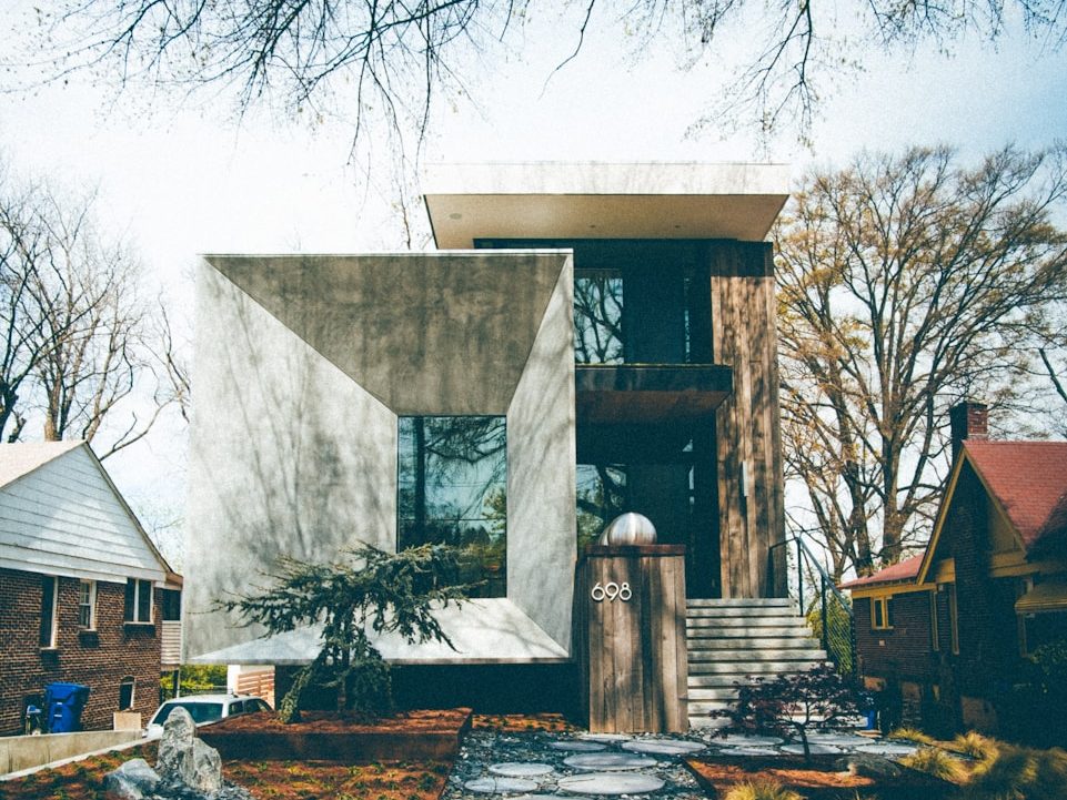 white and brown concrete house under blue sky